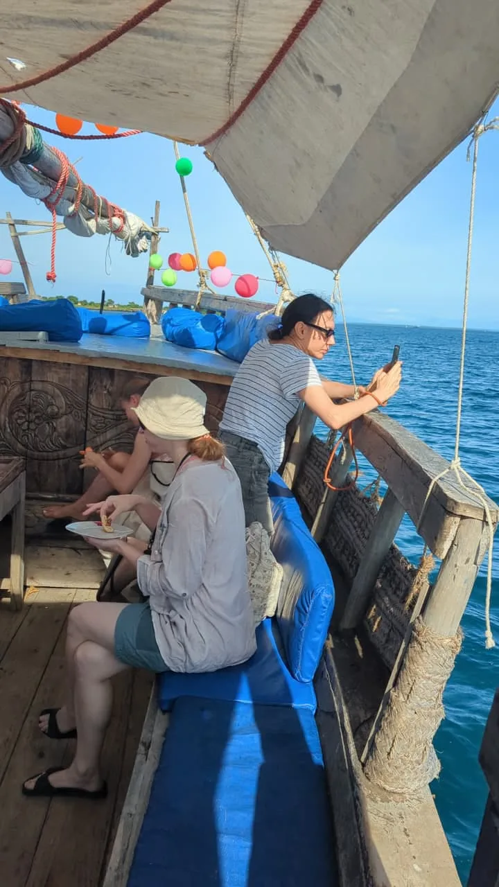 Traditional dhow sailing at sunset off the Kenyan coast