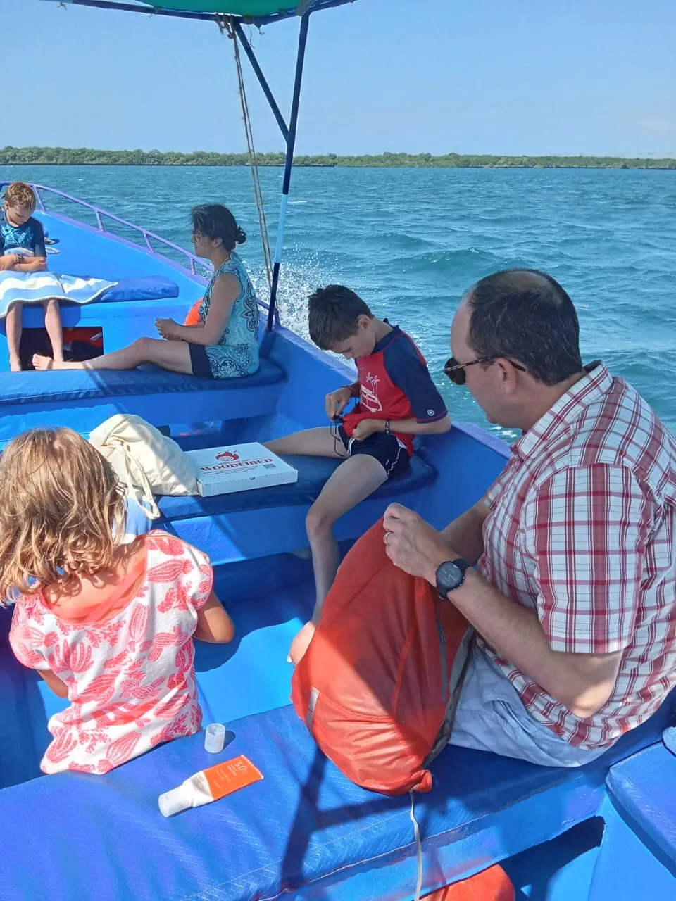 A family relaxing on a Vanta boat